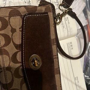 Coach wallet GUC minor ware from coins inside .possibly to clean